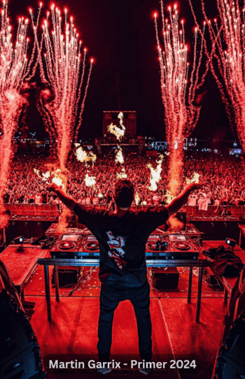 Synchronized fireworks explode in harmony with music, lighting up the night sky.
